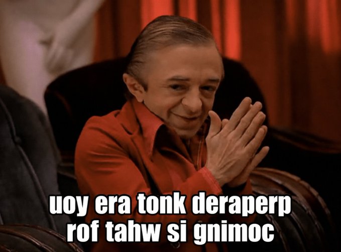 A meme featuring a man in a red shirt clapping with backwards text reading 'coming is what for prepared not knor are you', a play on 'you are not prepared for what is coming'.