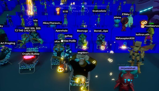 Screenshot of a virtual world metaverse game featuring numerous avatars with usernames like 'ROC SOL 305', 'kila', 'MikeyThereum_', 'TJ THE CREATOR', 'Apéwhale', 'Beanugz', 'Bored_Ape', 'MetasapienXXX', 'aegidos', and 'PixelSaurus'.