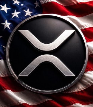 The image features a silver coin with an X symbol on top, which is prominently displayed against a backdrop of the American flag. The caption below the coin reads "CRYPTO MADE IN AMERICA TRUMP says: If crypto defines the future, it should be mined, minted, and built in the USA." This suggests that the image is promoting or celebrating the use of cryptocurrency as a means to shape the future.