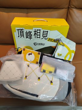 A 2026 Mid-Autumn Festival gift box from BiKingex and BiKing_CN sits open on a leather sofa, displaying its outdoor camping-themed contents including a white sun hat, folding hiking poles, a portable backpack, a quick-dry towel, and mooncakes, with the box prominently labeled "頂峰相見" (Meeting at the Peak).