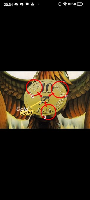 The image features a clock with an eagle design, surrounded by red circles that are labeled "goldgala". The clock has a gold background and black numbers and hands. The caption of the image reads "#XPR", which could be interpreted as a hashtag or a social media handle related to the post featuring the clock and the eagle design.