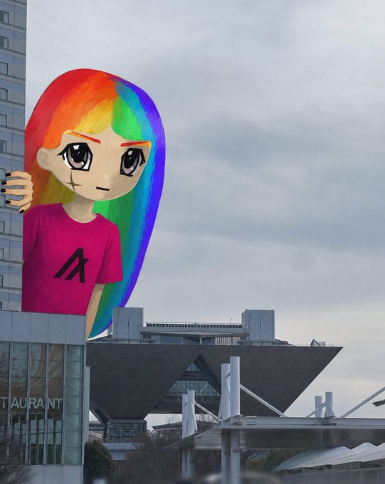 An anime-style illustration of a girl with rainbow-colored hair wearing a pink shirt with an 'A' logo, with a modern building and bridge in the background; partial text 'TAURANT' is visible.