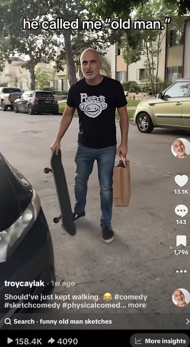 A TikTok video screenshot showing a bald man in a 'Puppets' black t-shirt carrying a skateboard, with overlay text 'he called me "old man."' and account 'troycavlak' posted 1 week ago.