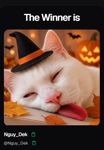 A winner announcement displaying a sleeping white cat wearing a small black witch hat with autumn leaves, awarded to 'Nguy_Dek' (@Nguy_Dek).