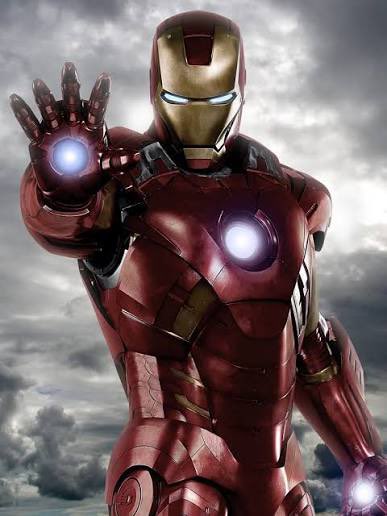 An image of Iron Man in his red and gold armored suit, posed with his palm facing forward and repulsor beams glowing white from his hand and chest.