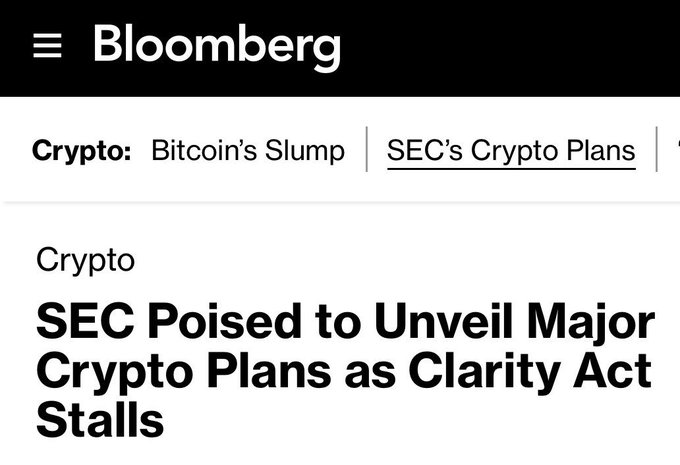 A Bloomberg article headline reads "SEC Poised to Unveil Major Crypto Plans as Clarity Act Stalls," under the "Crypto" section, relating to the post's discussion of SEC Chairman Paul Atkins's "Regulation Crypto" proposal advancing as a backup plan to the stalled CLARITY Act.