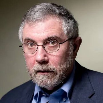 A close-up portrait shows a middle-aged man with gray hair, a gray beard, and round wire-rimmed glasses, wearing a dark blazer over a blue collared shirt—appearing to be economist Paul Krugman. The accompanying post references his 2009 dismissal of Bitcoin as a "stupid currency" and contrasts it with Bitcoin's 11,000x price increase since then.