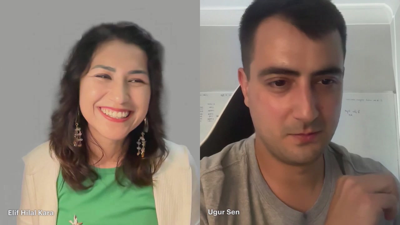 The image shows two people having a video call with their faces displayed on the screen. They are both smiling at the camera, creating a friendly atmosphere for the conversation. The person on the left side of the frame has long hair and is wearing earrings, while the other person on the right side has short hair and is also wearing earrings. Both individuals appear to be engaged in the discussion, making it an interesting and enjoyable experience.