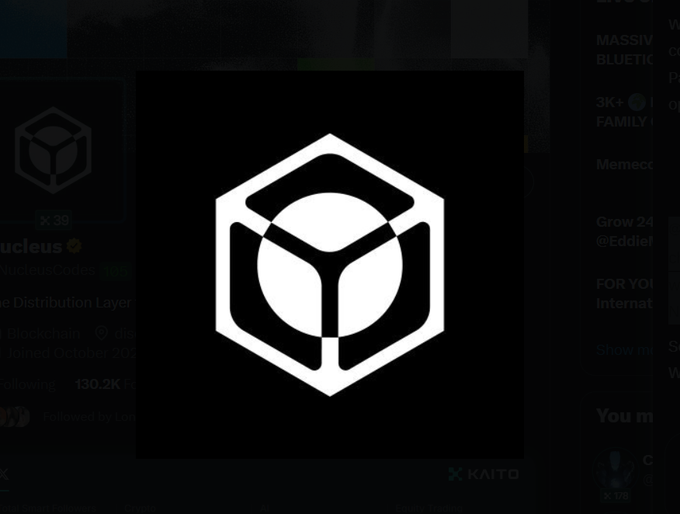 A prominent white hexagonal logo featuring a cube and circular design is displayed on a dark background, with the "KAITO" branding visible in the bottom right corner. The image represents NucleusCodes (Nucleus), a merit-based access platform mentioned in the post as an alternative to traditional airdrop farming.