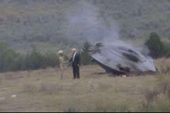A fire engine parked in a field with smoke rising from it, next to a person holding what appears to be a camera or surveying equipment. The image appears unrelated to the accompanying crypto/blockchain tweet about token issuers and base protocols.