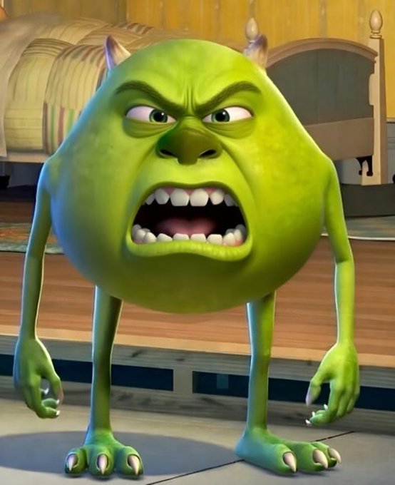 Mike Wazowski from Monsters, Inc. stands with an angry, shouting expression, clenched teeth, and tense posture—mirroring the post's frustrated tone about unpredictable crypto trading outcomes and broken deals.