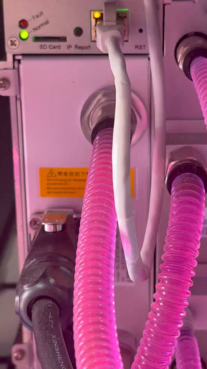 The image shows a close-up of a pink electrical cord with white connectors, which appears to be part of an electronic device or machine. The background is blurred, but there are some pipes visible as well. The text "It's Saturday! Todays Schedule: Mine BTC. Hold BTC. Repeat. Let's get after it!" is present in the image, suggesting that this might be a promotional post for Bitcoin mining or cryptocurrency-related activities on a weekend.
The main focus of the image is the pink cord and its connectors, which are part of an electronic device or machine.