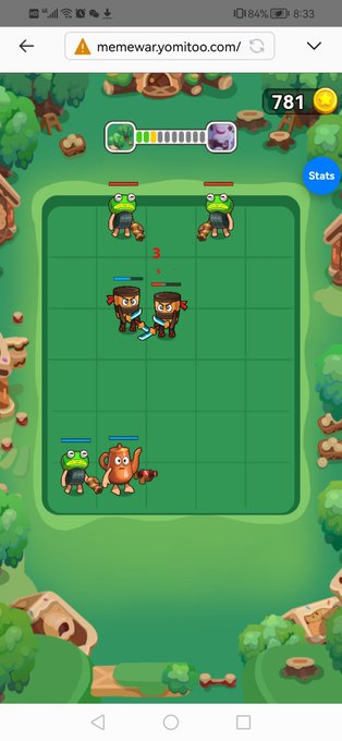 A mobile phone screenshot of a mobile game from "memewaryomitoo.com/" showing a grid battlefield with two green frog enemies and player characters including ninjas and an orange creature.