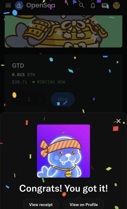 An OpenSea NFT marketplace screen showing a successful mint of a 'GTD' item for 0.015 ETH, with a 'Congrats! You got it!' message featuring a blue cartoon seal character wearing a headband.
