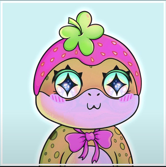 A cute cartoon illustration of a turtle or similar character wearing a pink strawberry-themed hat with a green clover on top, featuring large sparkling star-shaped eyes and a pink bow tie.