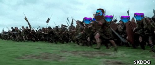 An edited scene from the movie Braveheart showing a charging army of medieval soldiers, with several warriors' faces replaced by figures wearing rainbow-striped sunglasses, watermarked '$KDOG' in the corner.
