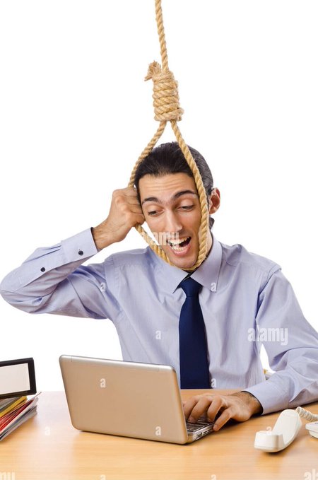 A businessman in a shirt and tie works at a laptop with a noose around his neck, depicting a stressed or desperate office worker.