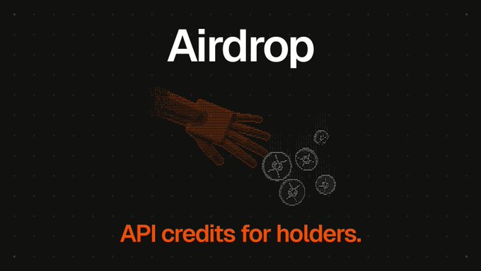 The image features a pixelated orange hand dropping cryptocurrency tokens (depicted with coin icons) against a dark dotted background, with the text "Airdrop" at the top and "API credits for holders." at the bottom in orange. This visual ties to the post's message by illustrating the reward distribution concept—specifically that UseLocal token holders receive benefits (API credits) through an airdrop mechanism, similar to the usage dividends described where 10% of revenue is shared with stakers.