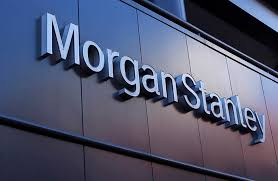 The image features a large, dark blue building with a sign that reads "Morgan Stanley" written in white letters. The text appears to be in Vietnamese, as indicated by the phrase "Quỹ ETF Bitcoin của Morgan Stanley đã mua hơn 25 triệu USD รัสดียง." This could possibly be a reference to the cryptocurrency market or an advertisement for a financial institution.