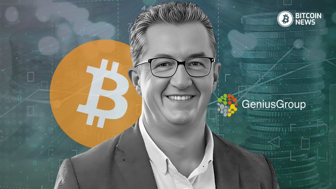 A smiling man in glasses and a blazer is featured alongside a Bitcoin logo, with the Genius Group logo and "Bitcoin News" branding visible in the background, illustrating the story of Genius Group's first Bitcoin repurchase after selling its treasury.