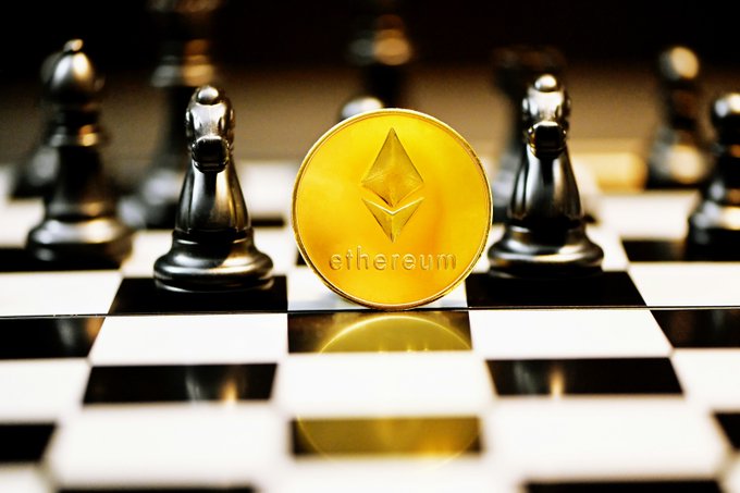 A gold Ethereum coin branded with the "ethereum" name and its signature diamond logo stands prominently on a chessboard, flanked by black chess pawns. The image visually ties to the post's theme of strategic, high-stakes moves in Ethereum's staking landscape, where institutional players navigate privacy, compliance, and traceability trade-offs.