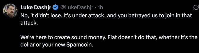 A tweet from Luke Dashjr (@LukeDashjr) stating: 'No, it didn't lose. It's under attack, and you betrayed us to join in that attack. We're here to create sound money. Fiat doesn't do that, whether it's the dollar or your new Spamcoin.'