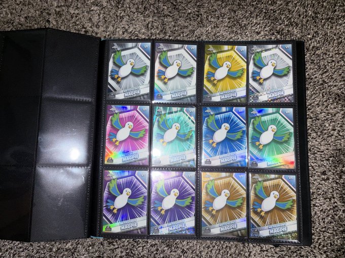 A black trading card binder page displaying twelve shiny holographic Galarian Mr. Mime Pokémon cards arranged in a 4x3 grid.