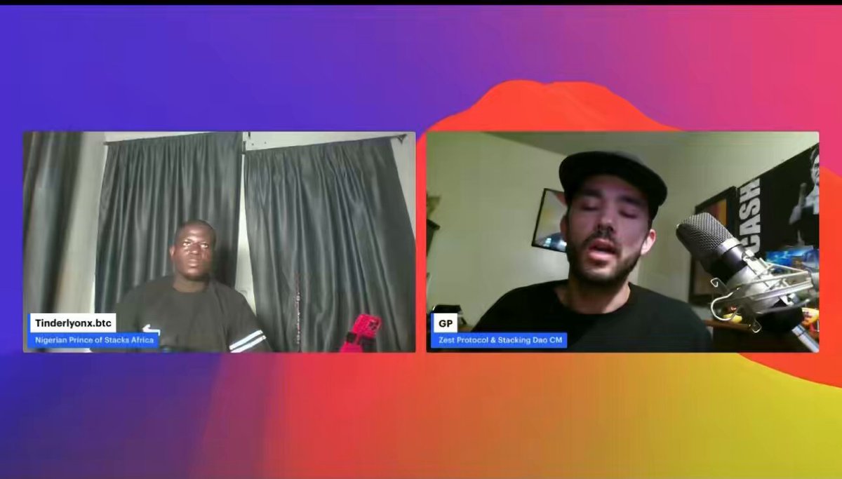 The image shows two men sitting behind microphones, with one man wearing a black hat and the other wearing a pink hat. They are both talking into their microphones during an online podcast or radio show. The background of the image features a gradient of colors that blend together, creating a vibrant atmosphere for the conversation. The post includes text such as "@GPSC_STX", "@Nakamoto1", and "@tinderlyonx". Additionally, there is a reference to Bitcoin Economy and @LunarCrush in the image description.