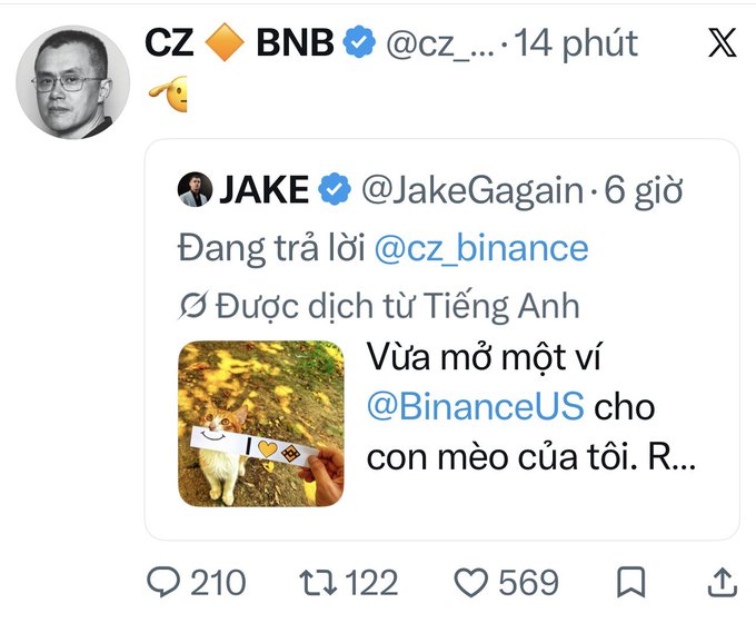 An X (formerly Twitter) post by CZ (Changpeng Zhao) retweeting a response from @JakeGagain, with Vietnamese text discussing opening a Binance US wallet for his cat.