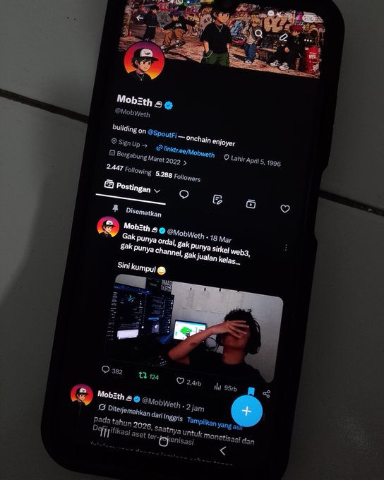 A smartphone displays the Twitter profile of "Mob₿th" (@MobWeth), an Indonesian crypto enthusiast boasting 5,288 followers and the tagline "building on @SpoutFi — onchain enjoyer." The latest post celebrates surpassing 5,000 followers and asks when the account might reach 10,000, directly matching the caption's reflection on unexpected growth.