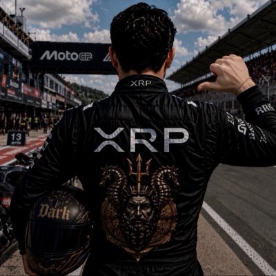 A person wearing a black leather jacket with "XRP" branding and an intricate mythological design on the back stands facing a MotoGP racetrack, holding a helmet marked "Dark." The image aligns with the post by visually emphasizing XRP through the prominent jacket logo and dark, bullish aesthetic, fitting the "2026 Bull-run profile picture" theme.