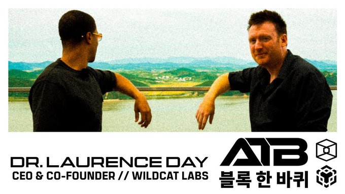 A promotional graphic featuring Dr. Laurence Day, CEO & Co-Founder of Wildcat Labs, with the ATB logo and Korean text '블록 한 바퀴' against a lake backdrop.