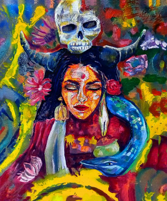 A vibrant, colorful painting portrays a woman with a bindi surrounded by surreal elements, including a skull above her head, a pink flower, and a blue serpent against a background of yellow, green, and red hues.