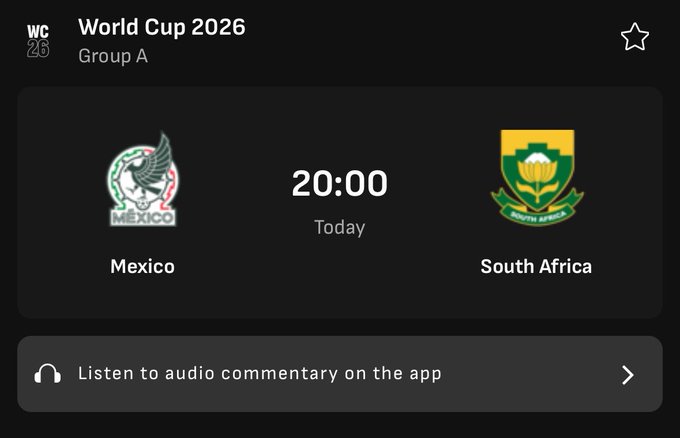 The image features a black screen with a green background, displaying text about World Cup 2026, which seems to be from a sports website or app. The time displayed is 20:00, suggesting that the soccer match between Mexico and South Africa is taking place at this hour. In the top right corner of the screen, there are two logos - one for Mexico's football team and another for South Africa's team. A user can listen to a podcast related to the game or even win 5 dollars by predicting the correct score of the match between these two teams.
