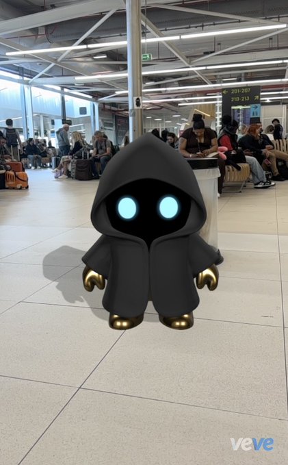The image features a 3D rendering of a robot-like figure wearing a black hooded robe, standing on a tiled floor with a clock visible in the background. The caption reads "Just wanted to send a big thank you to the entire MYO fam and movement, VeVe AR photos, and stories". This post seems to be promoting or celebrating the work of the MYO family and their 3D printing projects.