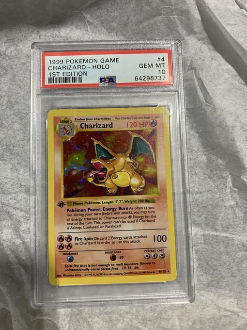 A PSA 10 graded 1999 Pokémon Game 1st Edition holographic Charizard card in a PSA slab, featuring the iconic fire Pokémon with its Gem Mint 10 certification label.