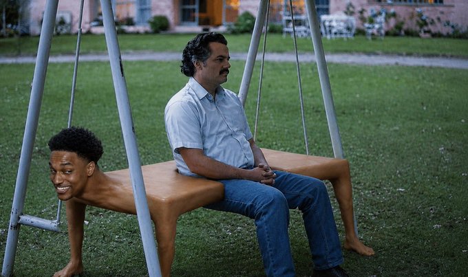 A meme image showing a man (resembling Pablo Escobar) sitting on a swing set with the body of a multi-legged creature, whose face appears to be edited to resemble Victor Wembanyama smiling.