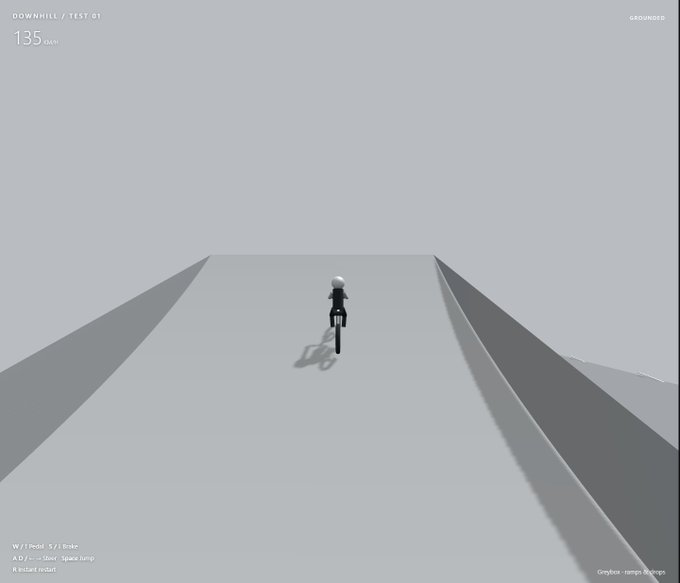 A video game screenshot showing a character riding a bike down a ramp, with text reading 'DOWNHILL / TEST 01', '135 km/h', 'GROUNDED', and control instructions 'W / Pedal  S / Brake', 'A / D ... Steer  Space Jump', 'R Restart respawn', 'Graybox - ramps & ramps'.