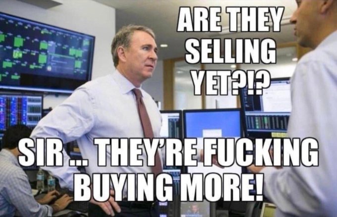 A meme image featuring two men in a trading floor setting with financial screens behind them, with text reading 'ARE THEY SELLING YET?!?' at the top and 'SIR.. THEY'RE FUCKING BUYING MORE!' at the bottom.