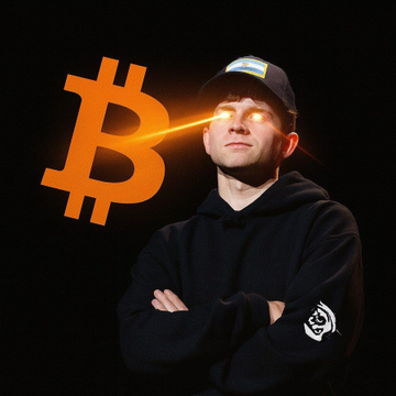 A man wearing a black hoodie and cap stands with crossed arms as a glowing orange Bitcoin logo shoots laser beams from his eyes. The image connects to the Bitcoin-focused news, as Jack Mallers—a prominent Bitcoin advocate and Strike founder—is stepping down from his CEO role at Twenty One Capital amid the scrapped merger with Strike and Elektron Energy.