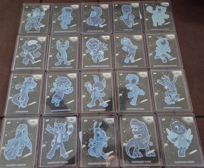 Twenty holographic blue character cards arranged in a 4x5 grid, each featuring a different stylized cartoon character against a starry background.