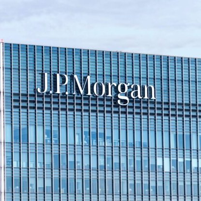 The J.P. Morgan building is shown with its name prominently displayed on the glass facade. The image illustrates the news about JPMorgan disclosing approximately $362 million in Bitcoin ETF holdings, highlighting the financial institution's significant exposure to cryptocurrency investments.