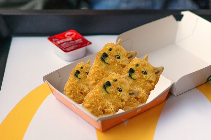 A Chick-fil-A box contains several chicken nuggets creatively decorated with black marks to resemble Shiba Inu faces, accompanied by a "Classic Sauce" container. The doge-faced nuggets playfully tie into the post about $DOGE's "glory days returning," suggesting the meme-inspired "doge" cryptocurrency is back in favor with crypto enthusiasts.