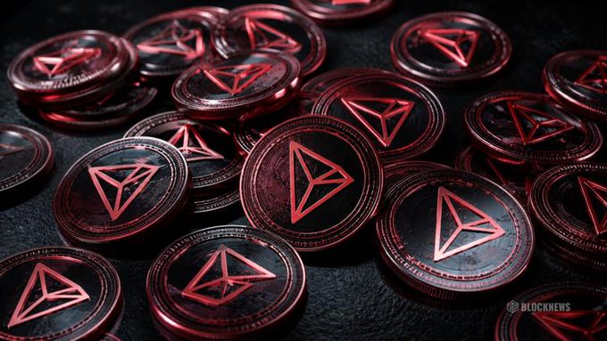 A pile of physical TRON (TRX) cryptocurrency coins with red and black branding, watermarked "BLOCKNEWS," visually reinforcing the post's claim of TRON's accelerating global adoption and surging daily active address growth across remittance markets.