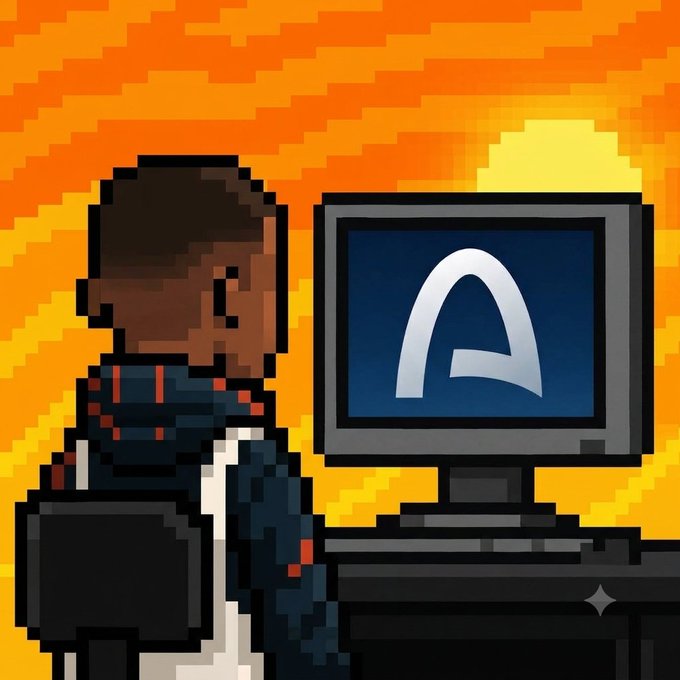 A pixel art illustration shows a person in a dark hoodie with red accents standing in front of a computer monitor displaying a stylized 'A' logo against a vibrant orange and yellow background.