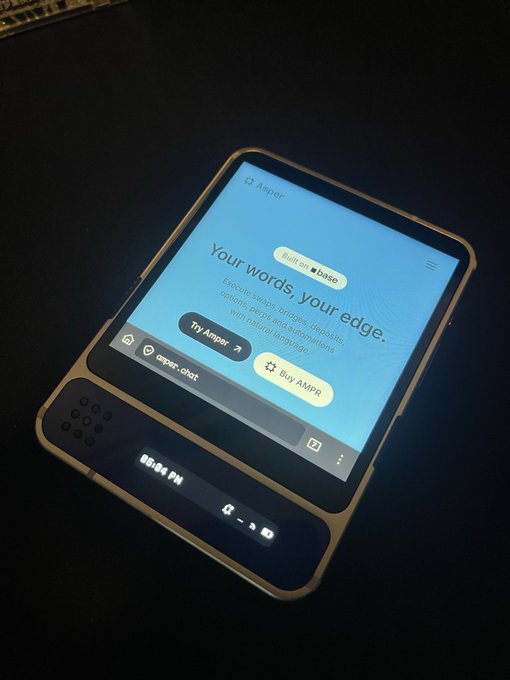The image shows an electronic device, possibly a tablet or e-reader, with a screen displaying a message that reads "Your words, your edge." The device appears to be turned off at the moment, as indicated by its black background. The text on the screen is in white and blue colors, which stands out against the dark backdrop of the device's screen.