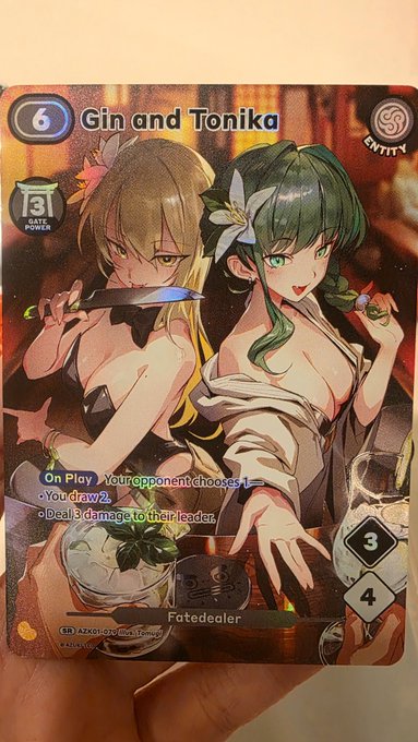 A trading card titled "Gin and Tonika" featuring two anime-style female characters, classified as an Entity card with Safe Power 3, Fate Dealer category, and stats of 3/4, with abilities including 'On Play, Your opponent chooses 1' and options to draw 2 or deal 3 damage to their leader.