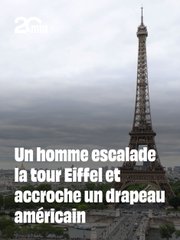 The Eiffel Tower stands tall against a gray Parisian sky, with a person visible near the top of the structure. A blue flag is attached to the tower. A "20 Minutes" logo appears in the upper left corner. The image illustrates the post about a man climbing the Eiffel Tower to mark 250 years of American independence, with the blue flag visible on the tower.