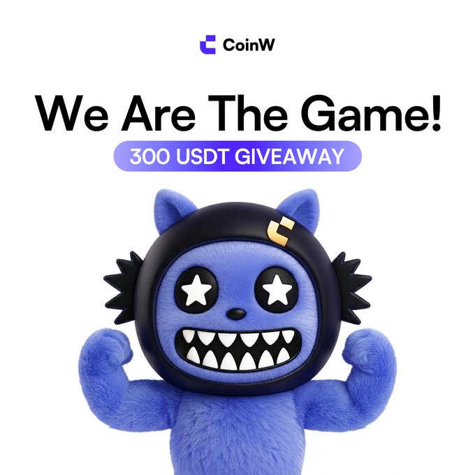 The image features a blue stuffed animal, possibly a monster or a robot, wearing a helmet and standing upright with its arms outstretched. The background of the image is white, which makes the blue color of the toy stand out even more. In the top right corner of the image, there's text that reads "We Are The Game! 300 USDT Giveaway". This suggests that there might be an ongoing promotion or contest related to a gaming event or achievement.