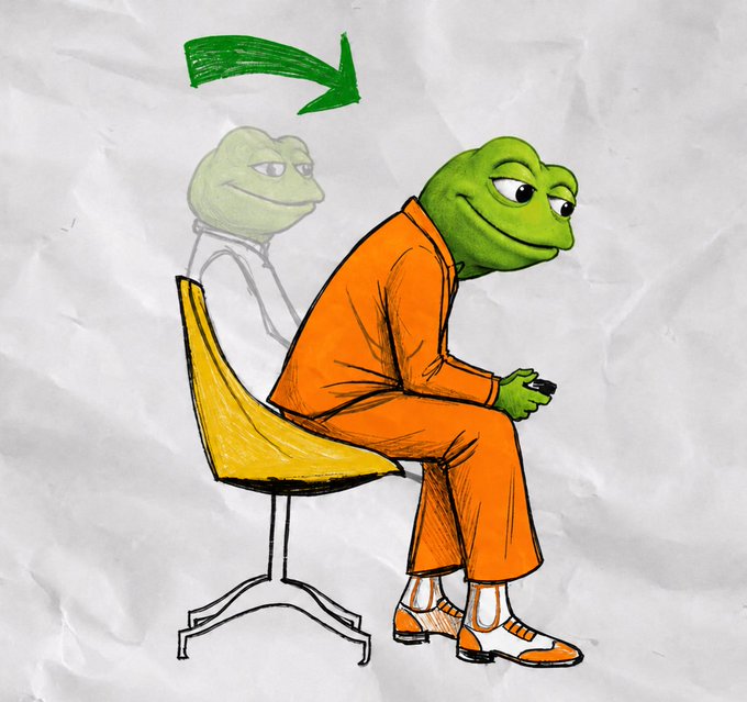 A drawing on crumpled white paper shows a Pepe the Frog character in an orange prison jumpsuit sitting on a yellow chair, looking at a phone. A faded outline of the frog is shown standing behind the chair, with a green arrow pointing toward the seated frog.